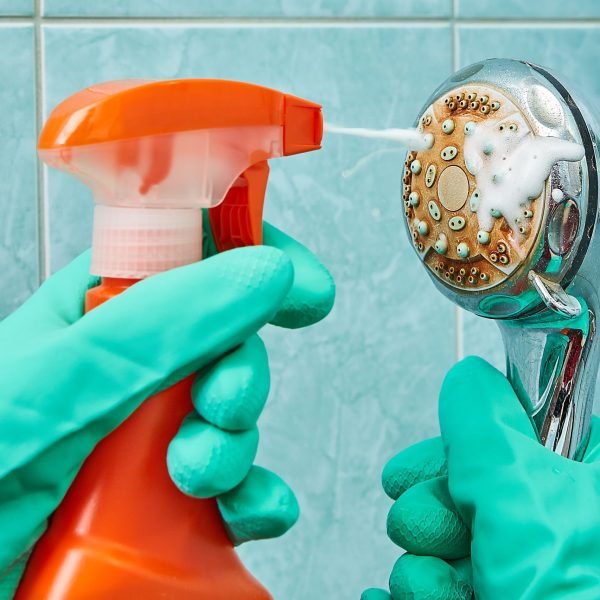 cleaning-the-head-of-shower-with-a-foamy-liquid-close-up-939328594-aae8217baaa042859704a5c5c195411a.jpg